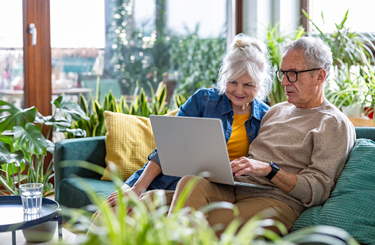 Couple looking at laptop